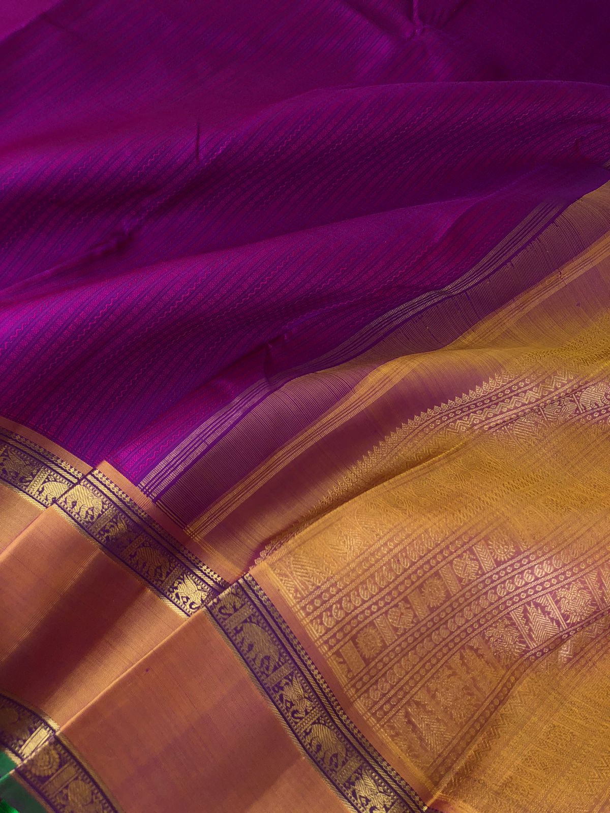 Yarn play on Kanchivaram - the deep purple pink full body vertical veldhari with retta pett woven borders and gorgeous grand gold zari woven pallu