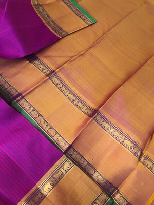 Yarn play on Kanchivaram - the deep purple pink full body vertical veldhari with retta pett woven borders and gorgeous grand gold zari woven pallu