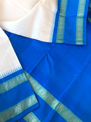 Kanchivarams Connected by Korvai - unusual pale calcium off white and blue korvai Kanchivaram with rett pett woven borders