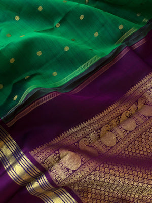 Shree - Bliss of Kanchivarams - gorgeous emerald green with deep jammun purple retta pett rudurakasham woven borders