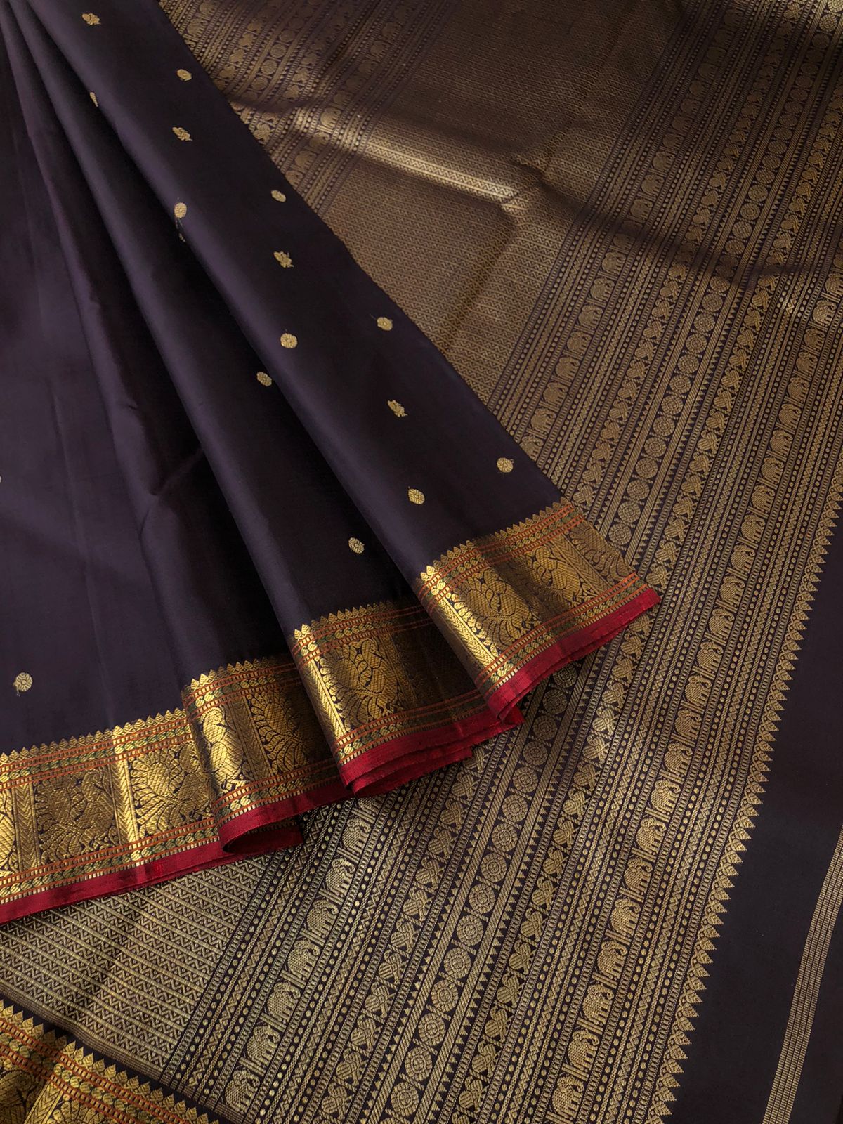 Radhe a album of rare find Kanchivaram - beautiful coal black with small annapakshi woven borders and tiny buttas woven body