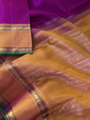 Yarn play on Kanchivaram - the deep purple pink full body vertical veldhari with retta pett woven borders and gorgeous grand gold zari woven pallu