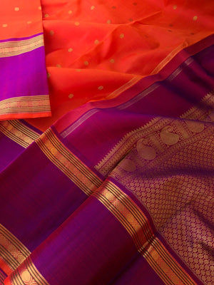 Kamakshi- Traditional Kanchivarams - the best of orange and purple broad borders Kanchivaram with stunning gold zari woven pallu