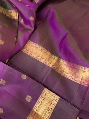 Shree - Exclusive Kanchivarams - a perfect mix of purple and green a dual tone Kanchivaram with super stunning pallu and borders