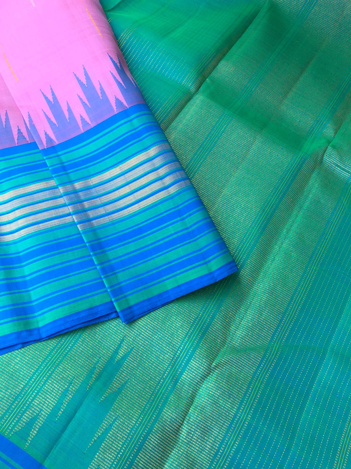 Korvai stories on authentic Kanchivaram - beautiful bubble gum pink and dual tone aqua blue green a stunner korvai Kanchivaram with silver and gold zari woven rain drops woven body