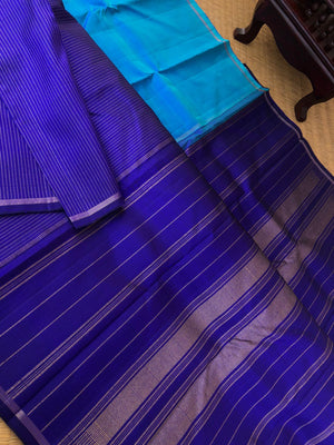 Ragaa - Classy Corporate Kanchivarams - a combination of anandha blue and ink blue aarai baagam Kanchivaram with gold oosi stripes woven bottom half