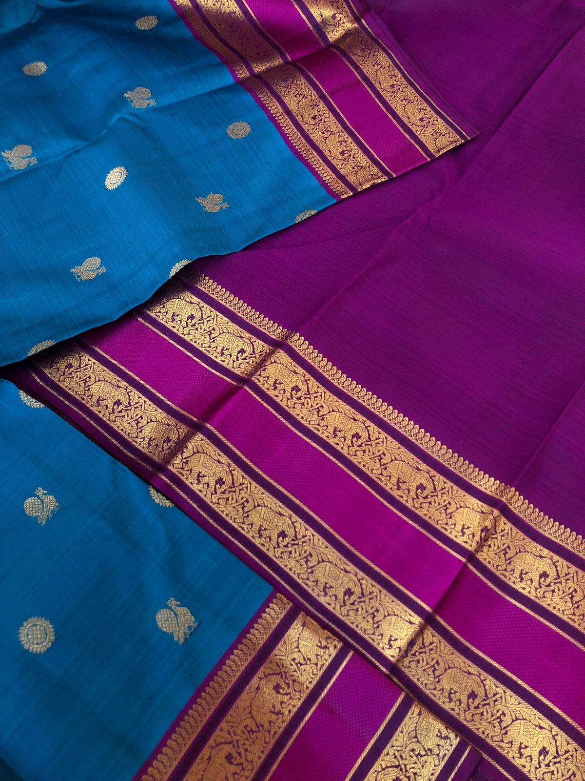Kaviyam on Kanchivarams - the most beautiful peacock blue with purple intricate gold zari woven pallu with elephant motifs woven retta pett borders