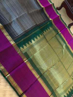 Yarn play on Kanchivaram - black and grey varusai pett with oosi gopuram borders contrasting green pallu and blouse