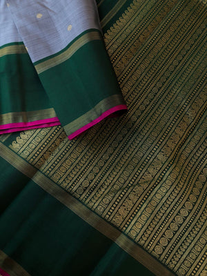 Festive vibes on Kanchivarams - mettalic steel grey and deepest green with majenta pink sleeve everything is stunning about this saree