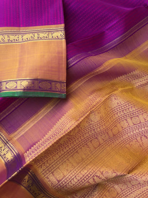 Yarn play on Kanchivaram - the deep purple pink full body vertical veldhari with retta pett woven borders and gorgeous grand gold zari woven pallu