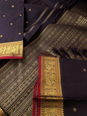 Radhe a album of rare find Kanchivaram - beautiful coal black with small annapakshi woven borders and tiny buttas woven body