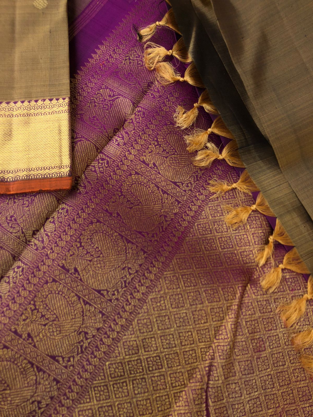 Swarnam - The lineage of Authentic Kanchivaram - the molten golden alloy and deepest purple Kanchivaram with rudurakasham buttas woven body and ketti pett woven borders and gorgeous grand pallu