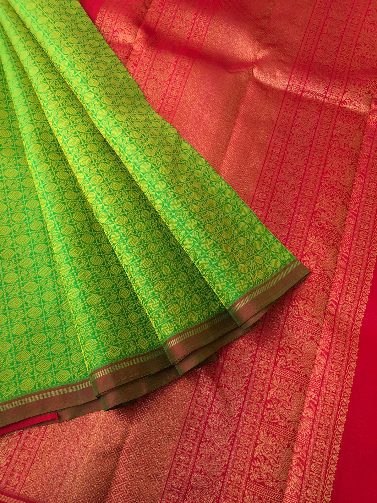 Yarn Play on Kanchivarams - a super gorgeous parrot green and red 1000 Mayil chackaram buttas