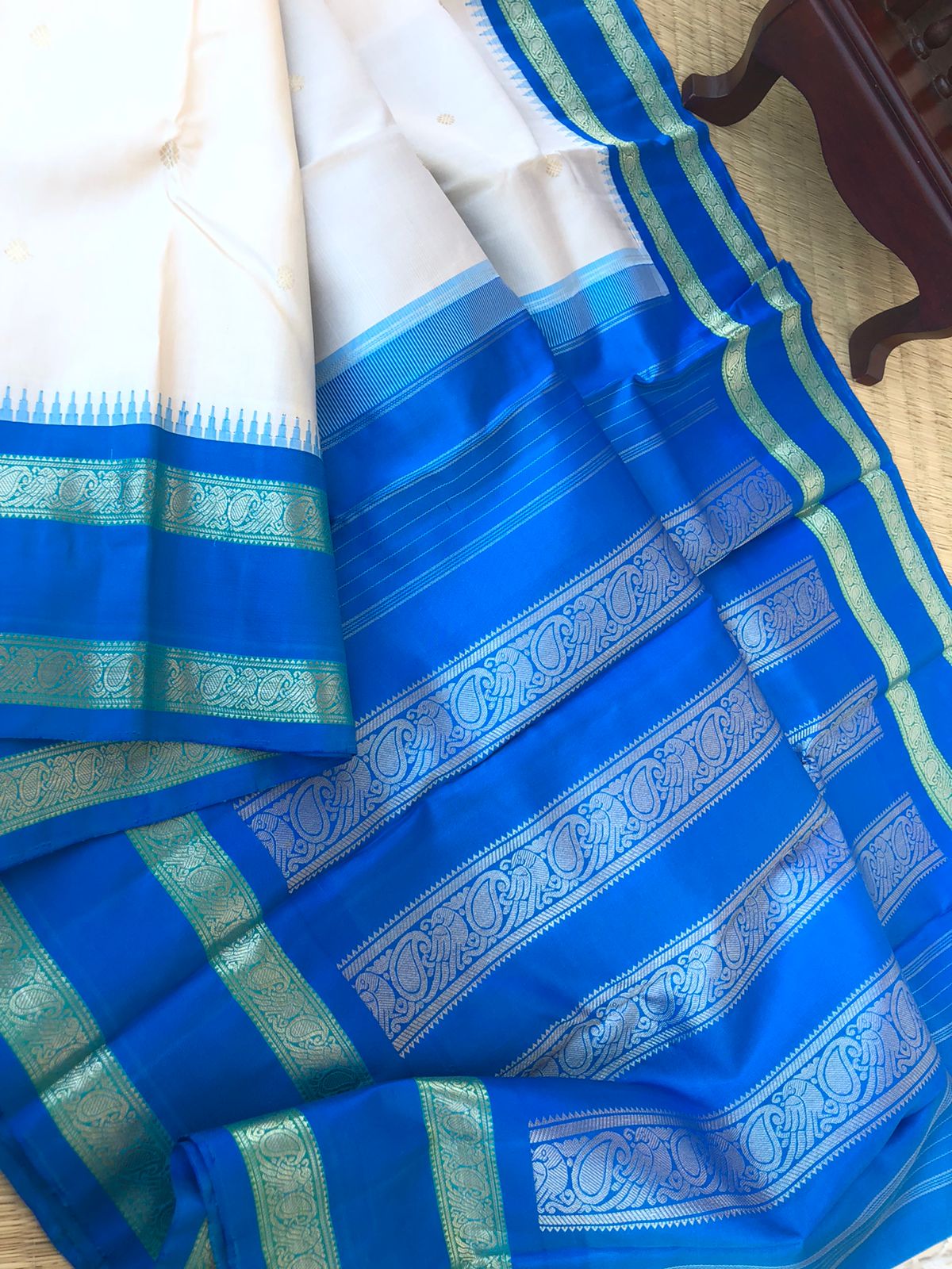 Kanchivarams Connected by Korvai - unusual pale calcium off white and blue korvai Kanchivaram with rett pett woven borders