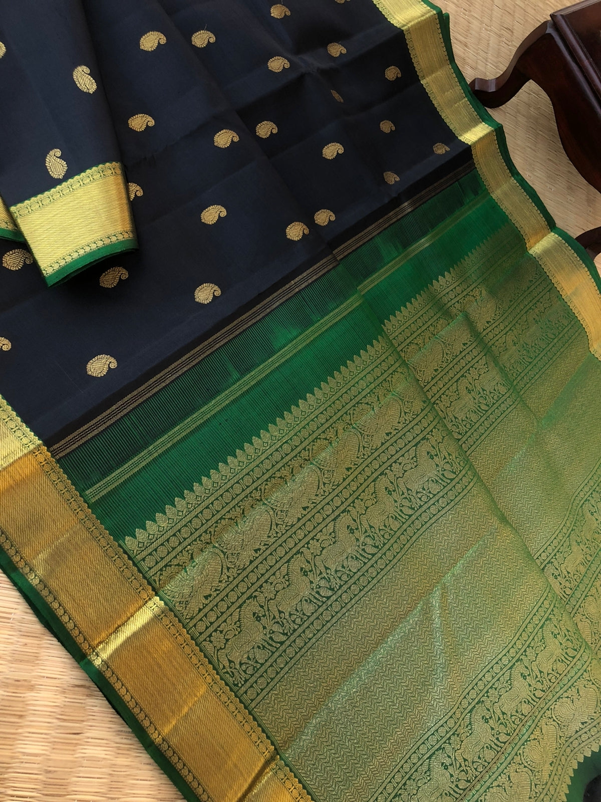Swarnam - Black and Gold Kanchivarams - best of black and bottle green with gorgeous grand pallu and paisley buttas woven body