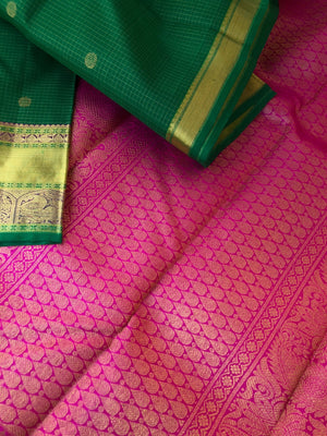 Kamakshi - Traditional kattams on Kanchivarams - most beautiful traditional green and rani pink with podi kattam ( tiny chex) with chackaram buttas over the body with densely woven pallu