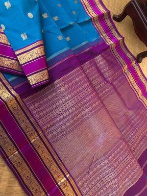 Kaviyam on Kanchivarams - the most beautiful peacock blue with purple intricate gold zari woven pallu with elephant motifs woven retta pett borders