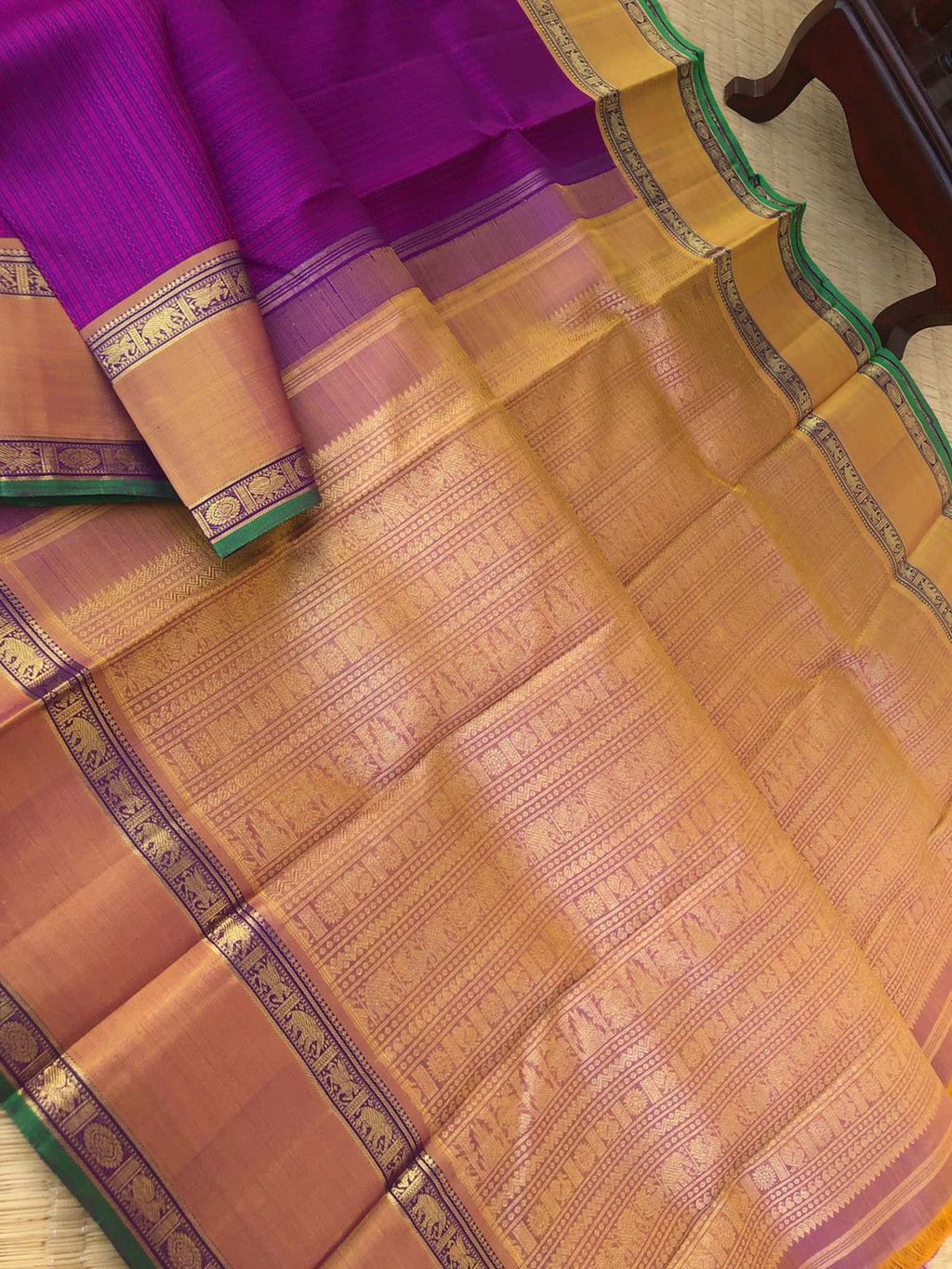 Yarn play on Kanchivaram - the deep purple pink full body vertical veldhari with retta pett woven borders and gorgeous grand gold zari woven pallu