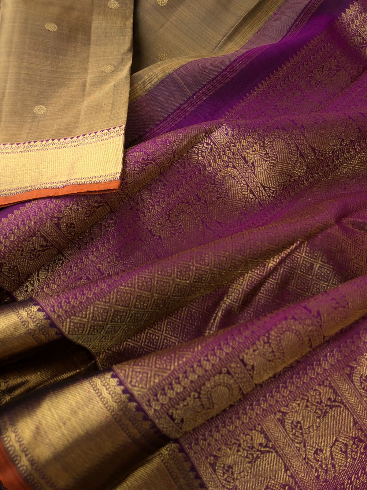 Swarnam - The lineage of Authentic Kanchivaram - the molten golden alloy and deepest purple Kanchivaram with rudurakasham buttas woven body and ketti pett woven borders and gorgeous grand pallu